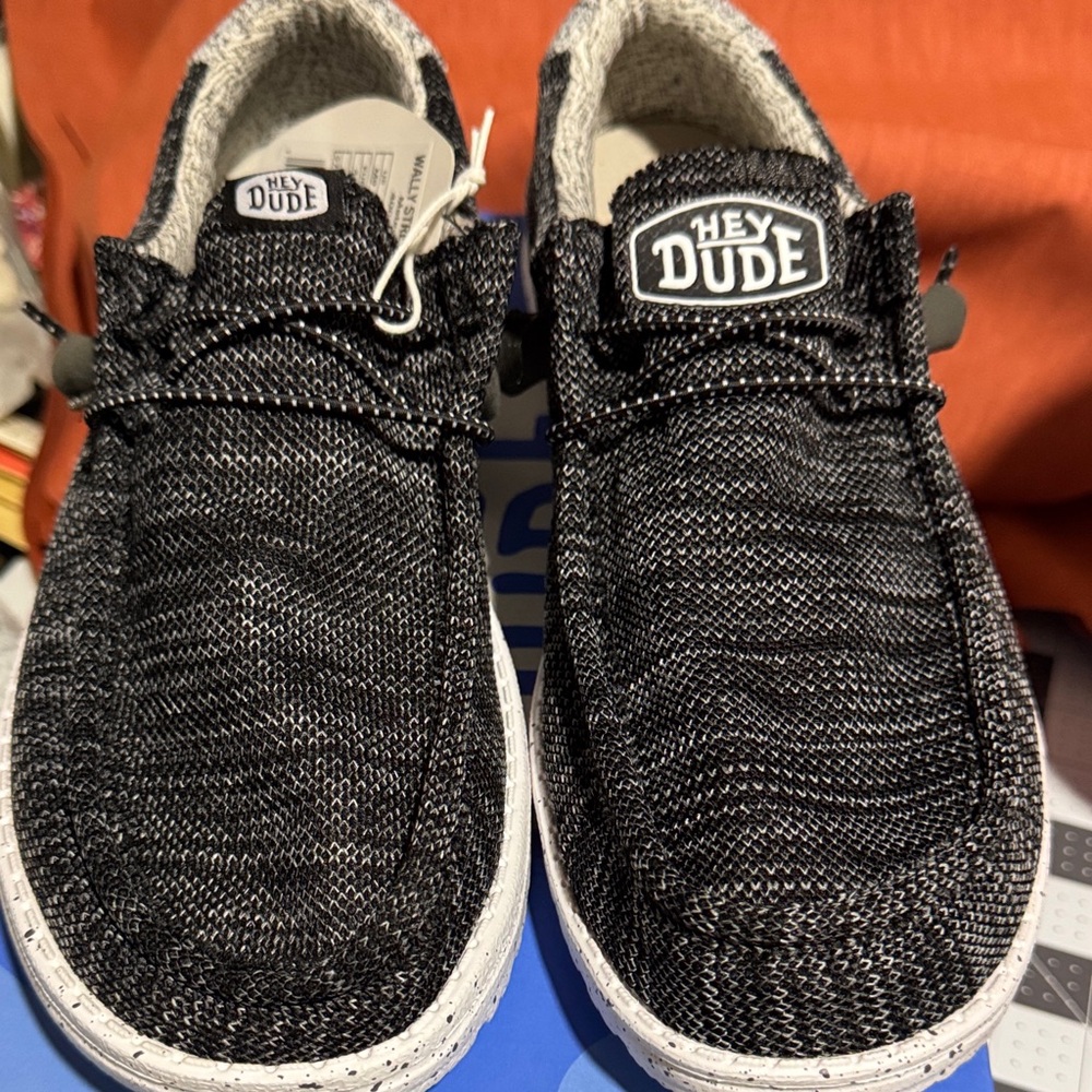 Hey Dude Black and White Men's slipper New inbox. Left foot 10 M right foot 9M